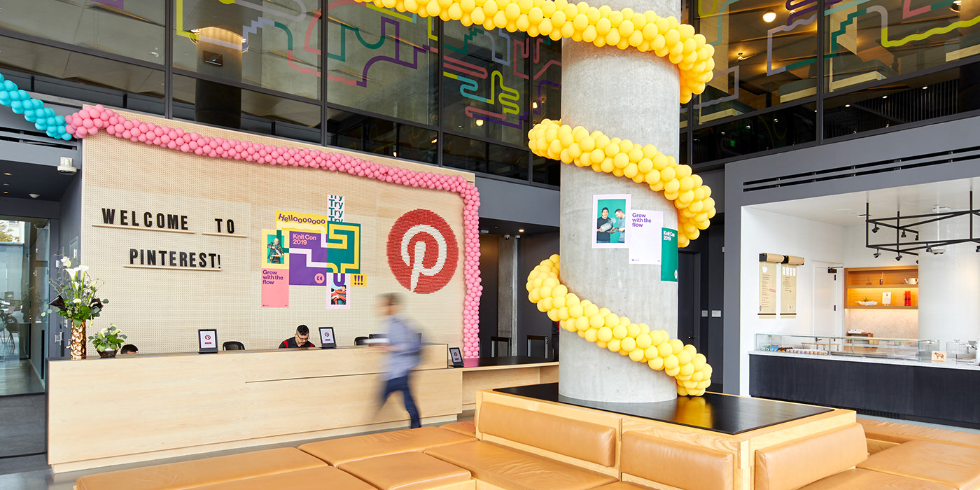 The reception desk at Pinterest Headquarters that is displaying signage for Knit Con 2019