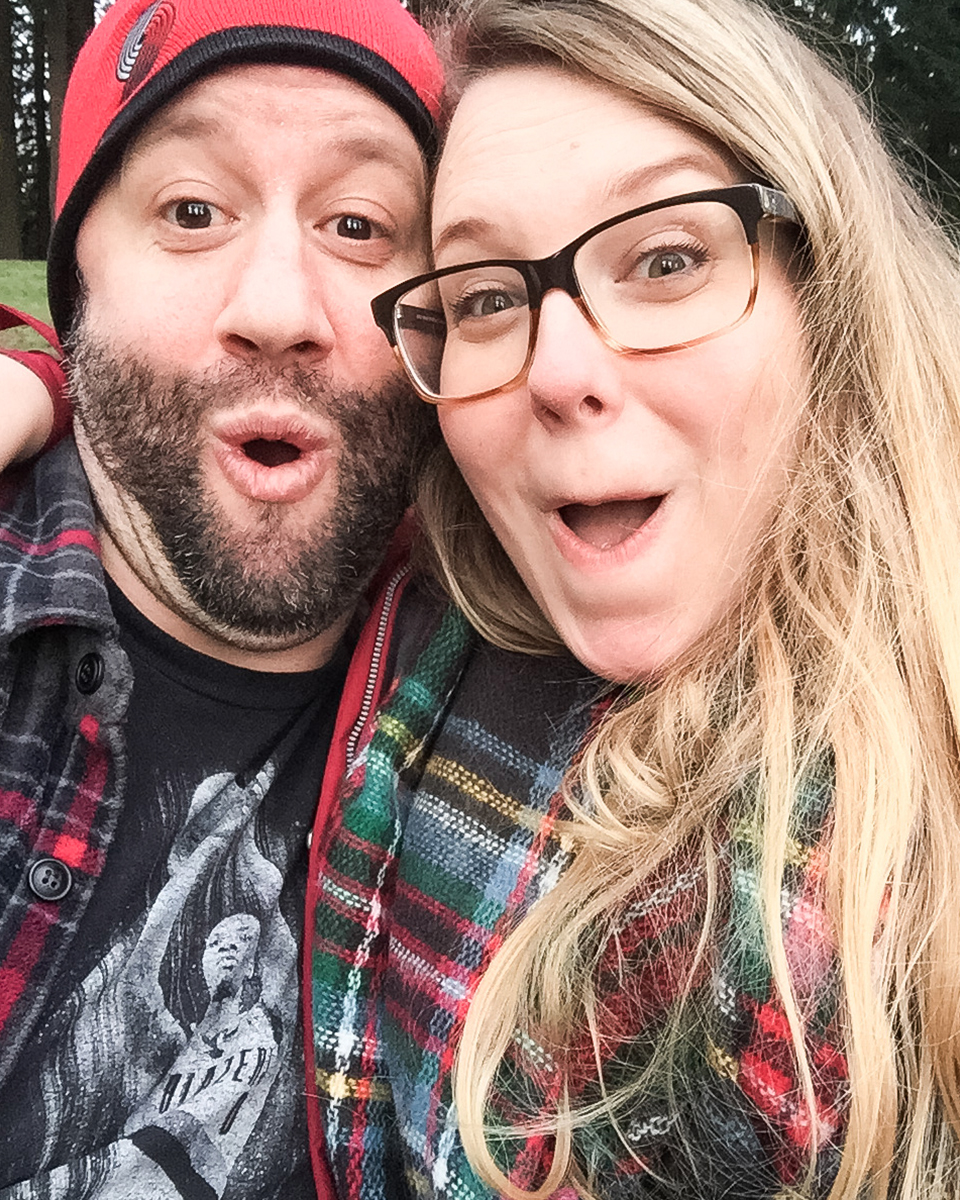 A woman and a man making silly faces at the camera during winter